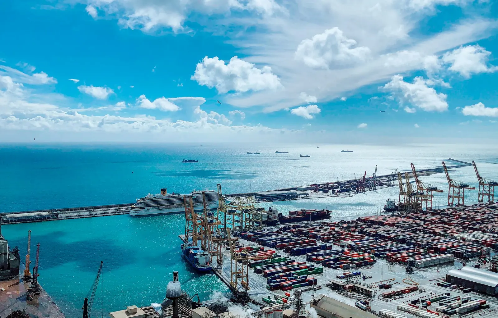 Container terminal of the port of Barcelona under a blue sky